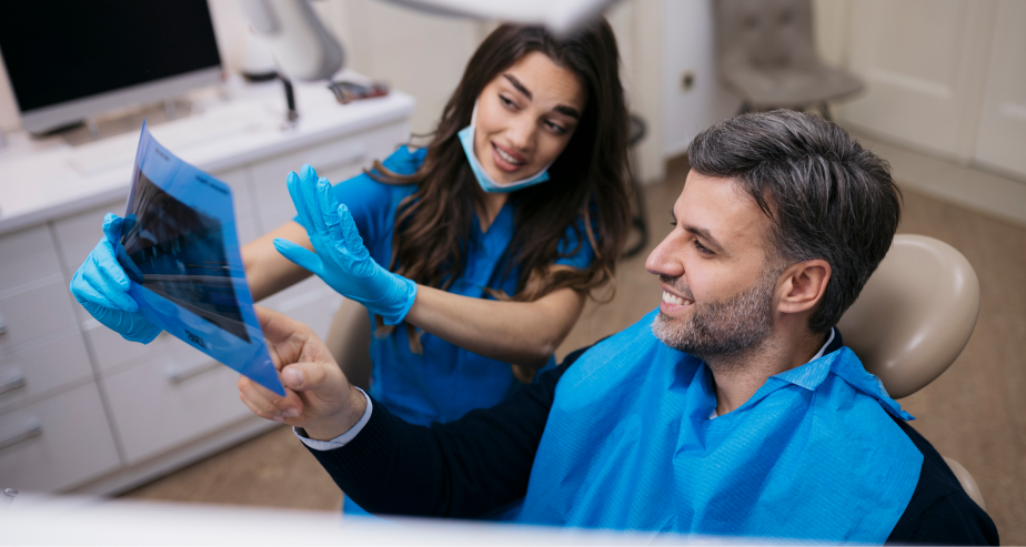 Dentist explaining an xray to a patient
