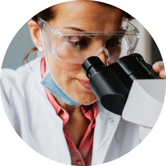 Dentist looking in a microscope